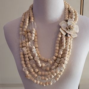 Anthropologie large wooden beaded Statement Necklace with sea shell flower.
